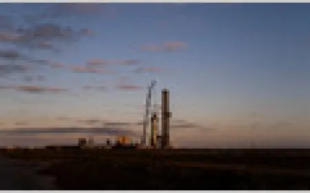 A SpaceX Falcon 9 rocket stands on the launch pad during daylight operations.