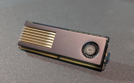 RAM modules fitted with active cooling fans and thermal monitoring displays installed on a motherboard.