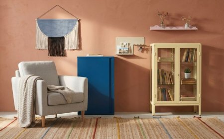 Living room with neutral furnishings, natural wood finishes, and built-in storage for seasonal organization.