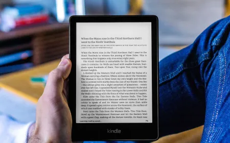 A close-up of the 2021 Kindle Paperwhite e-reader displaying a book page on its 6.8-inch screen.