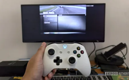 A wireless gamepad connected to a Samsung device displaying the DeX desktop interface.