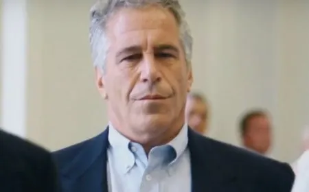 Police officers review documents related to historical abuse allegations from the Epstein files.