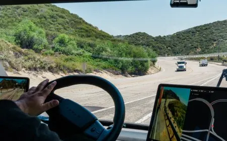 A Tesla Semi electric truck is parked on a California highway.