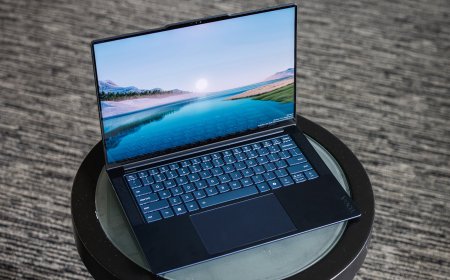 Several modern laptops are positioned side by side for academic comparison.
