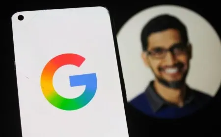 The keynote stage displays updated AI infrastructure metrics and Gemini agent technology at Google I/O 2026.