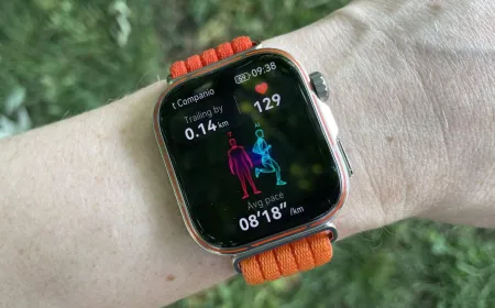 The Huawei Watch Fit 5 Pro smartwatch is displayed on a wrist with its screen illuminated.
