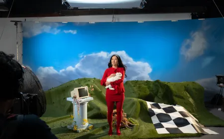 A Mad Hatter and a giant rabbit sit around a table discussing an artificial intelligence startup.