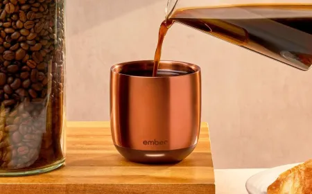 Ember Temperature Control Smart Cup resting on its magnetic charging base