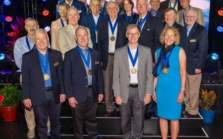 Two shuttle-era spacewalkers are inducted into the Astronaut Hall of Fame.