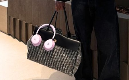 Unreleased pink Beats headphones are displayed on a neutral surface.