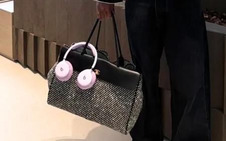 Unreleased pink Beats headphones are displayed on a neutral surface.