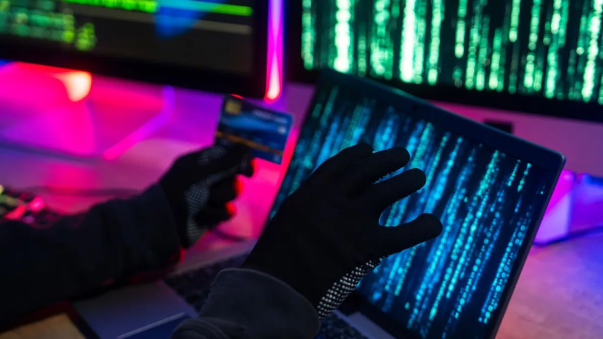 Physical office intrusion by cybercriminals stealing sensitive data via USB drives for ransom extortion.