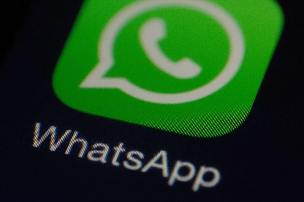The graphic shows the European Union flag alongside WhatsApp and artificial intelligence chatbot icons.