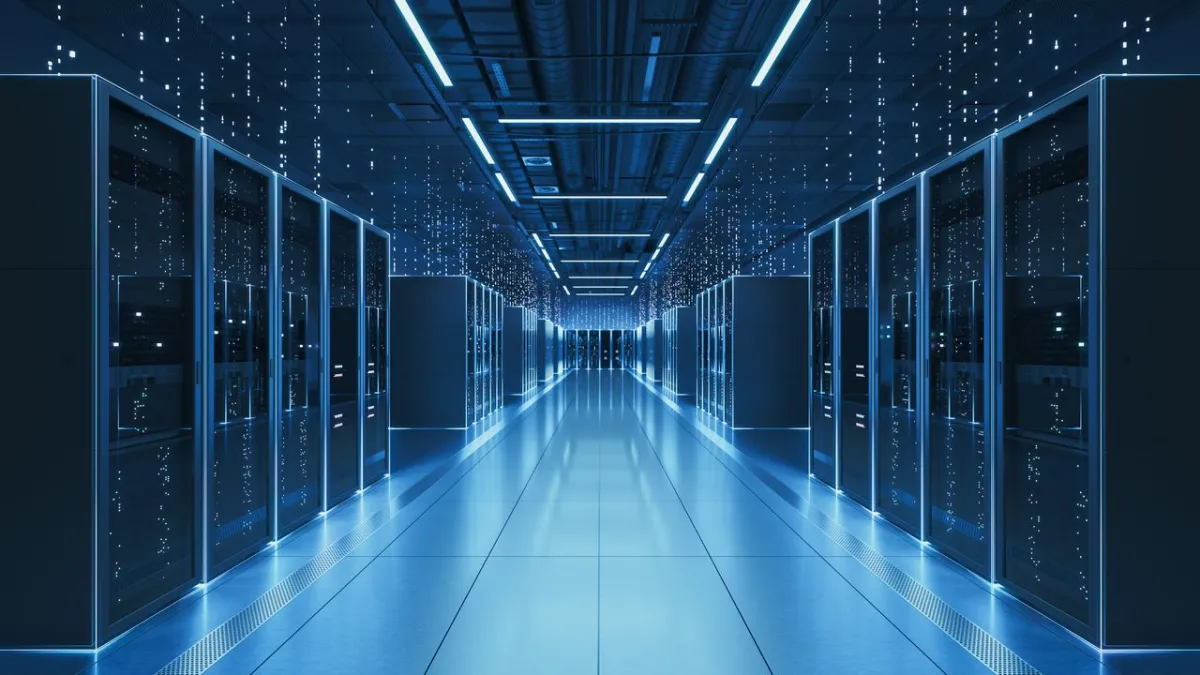 A technician conducts routine preventive maintenance on server racks in a data center.