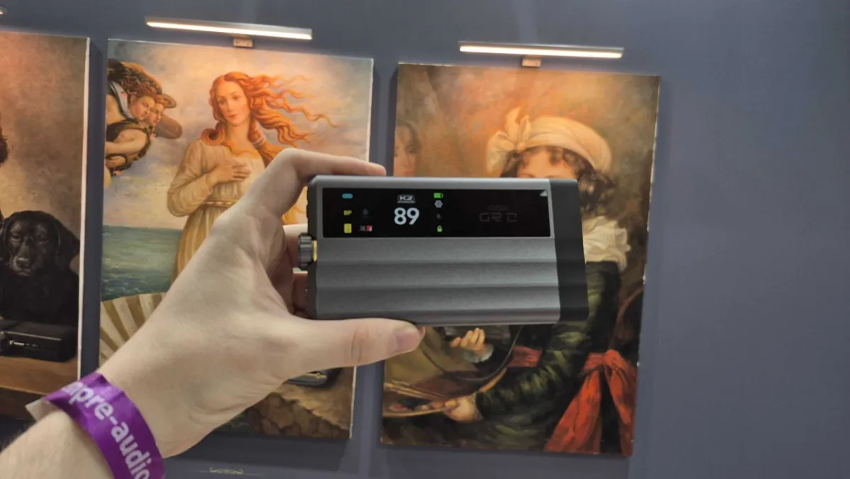 The iFi iDSD GR 2 portable DAC is shown with its color touchscreen and control panel clearly visible.