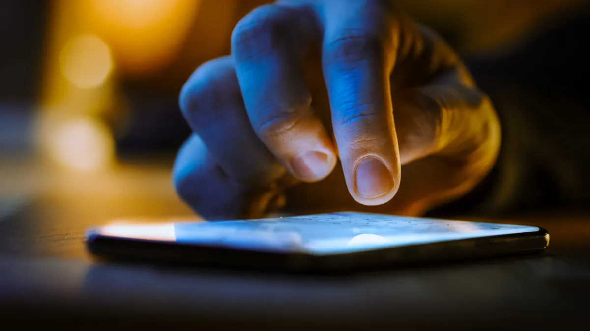 A laptop screen shows a chat interface next to legal documents highlighting artificial intelligence safety concerns.