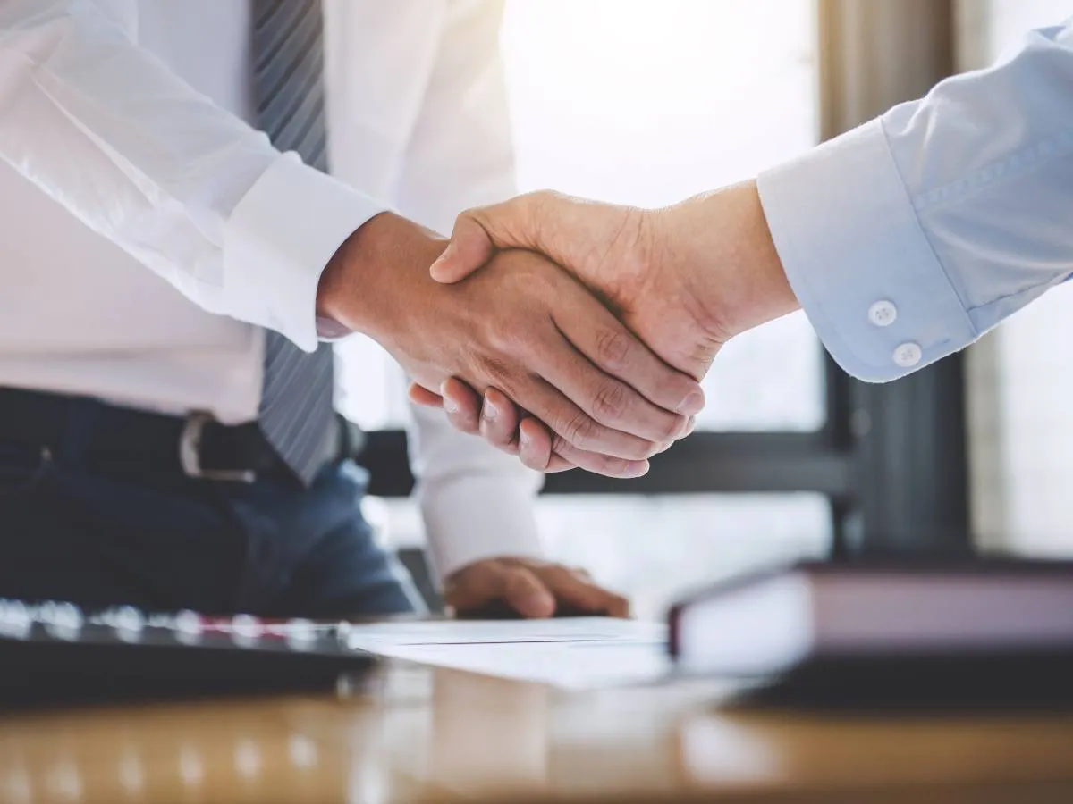 Nuvei and Payoneer logos representing the $2.75 billion acquisition deal