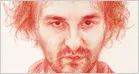 Sam Bankman-Fried in a federal prison setting discussing his memoir and political shift