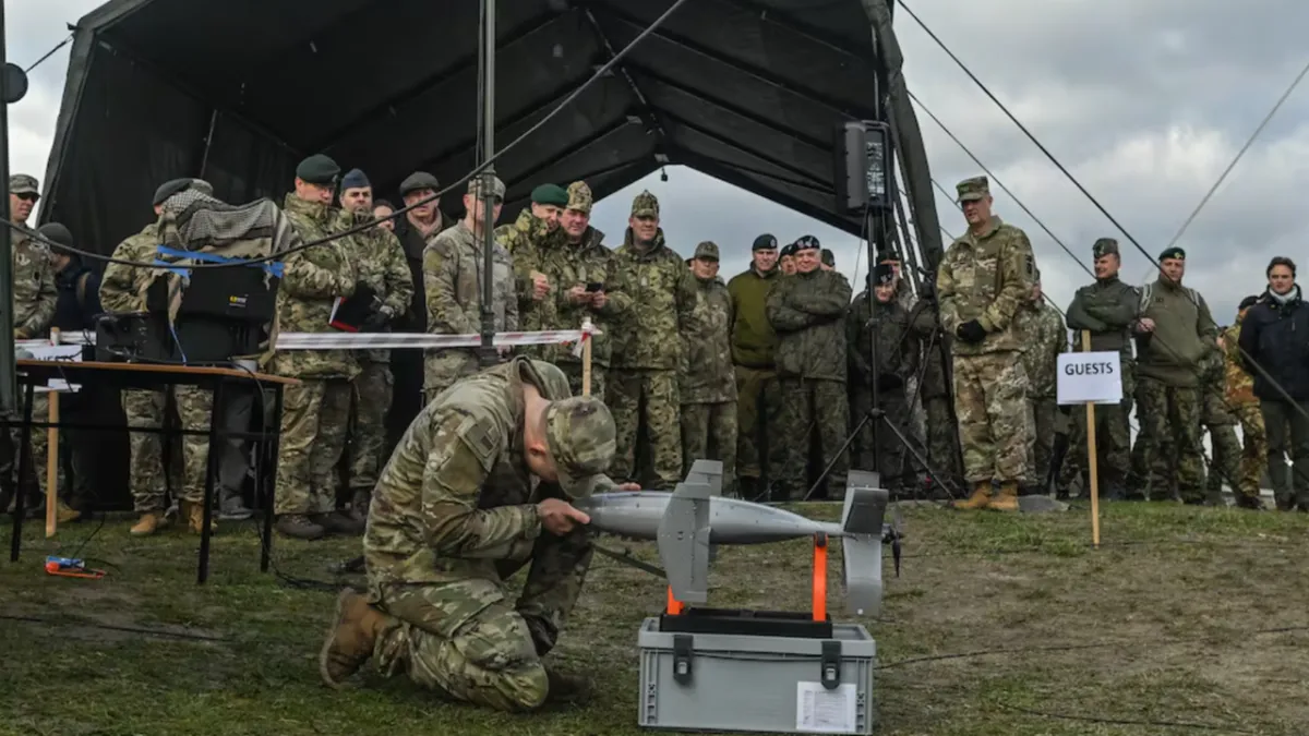 A modified commercial drone carries a small explosive payload to demonstrate how affordable aerial assets change modern co...