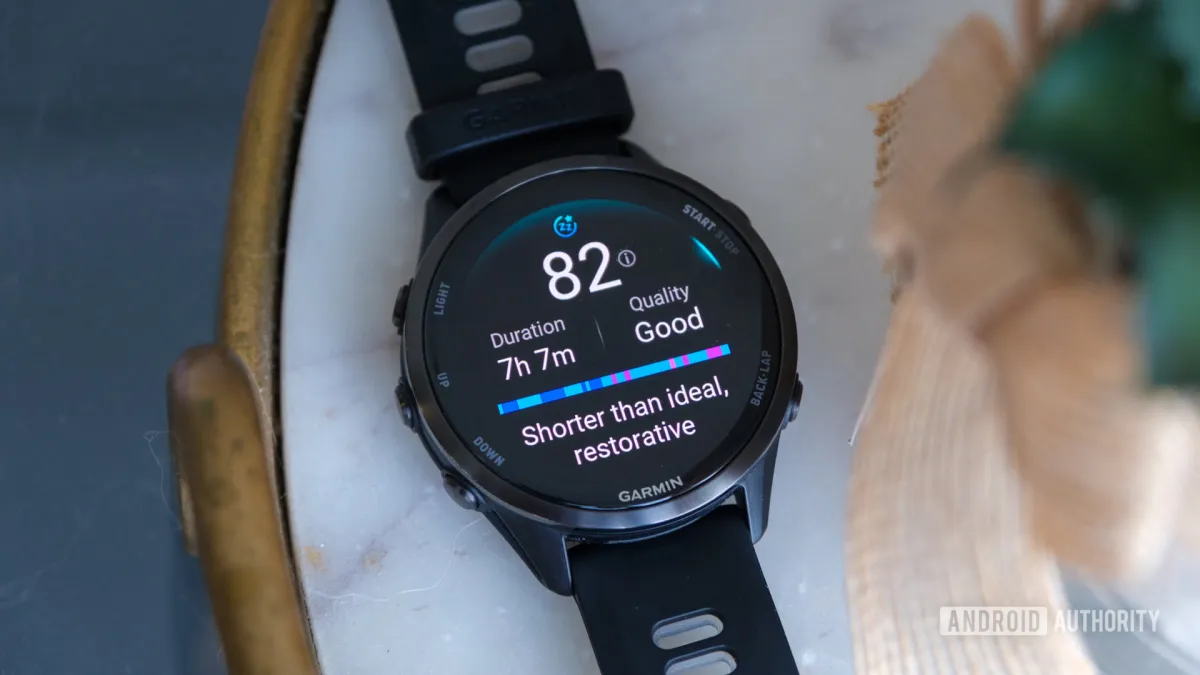 The Garmin Forerunner 970 smartwatch shows its titanium and sapphire build, multi-band GPS, and integrated LED flashlight.