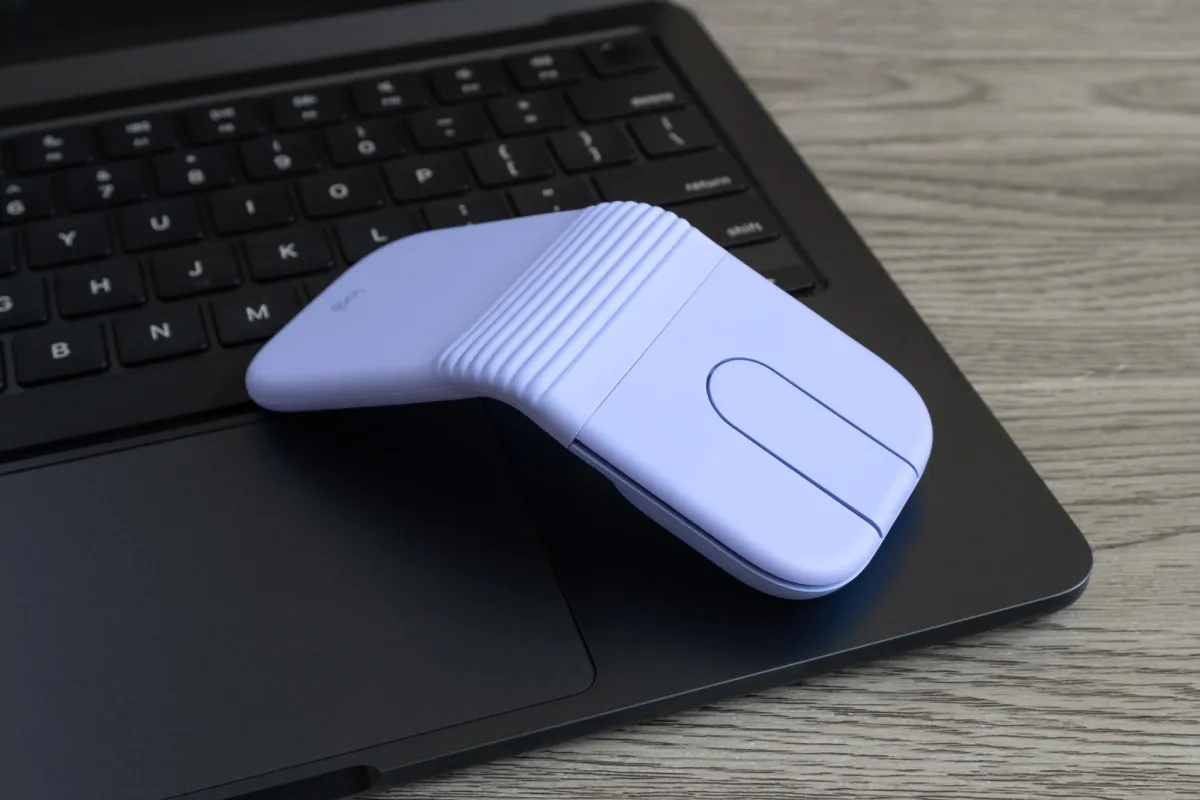 The Logitech Mobi Fold mouse is shown in its closed clamshell configuration, highlighting its compact pocket-sized design.