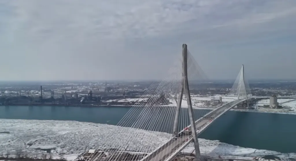 The Gordie Howe Bridge construction site spans the Detroit River between Canada and the United States.