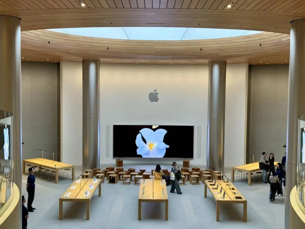 Apple logo displayed with regulatory documents to illustrate the delayed Siri AI rollout in the European Union and China.