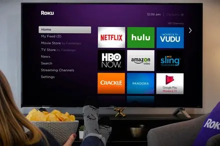 Roku branding and streaming visuals illustrate the company's ongoing strategic sale discussions.