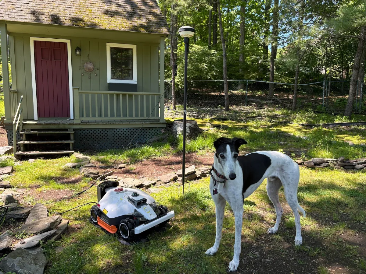 The Mammotion Luba 3 AWD mower navigates uneven terrain using satellite positioning and obstacle sensors.