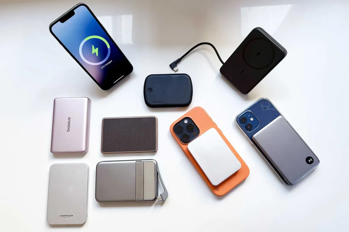 A compact magnetic power bank attaches securely to the back of an iPhone for wireless charging.