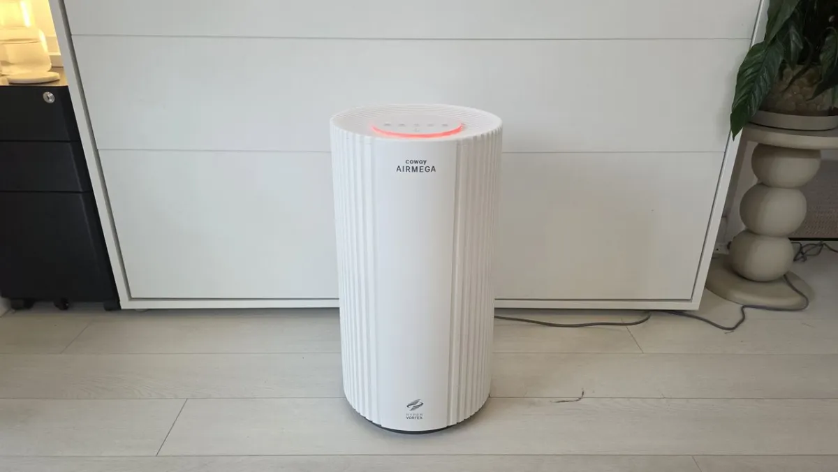 The Coway Airmega 350 air purifier features a white casing, a circular control panel, and a central air quality sensor.