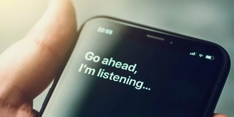 The presentation highlights Apple's updated Siri interface and Apple Intelligence rollout strategy.