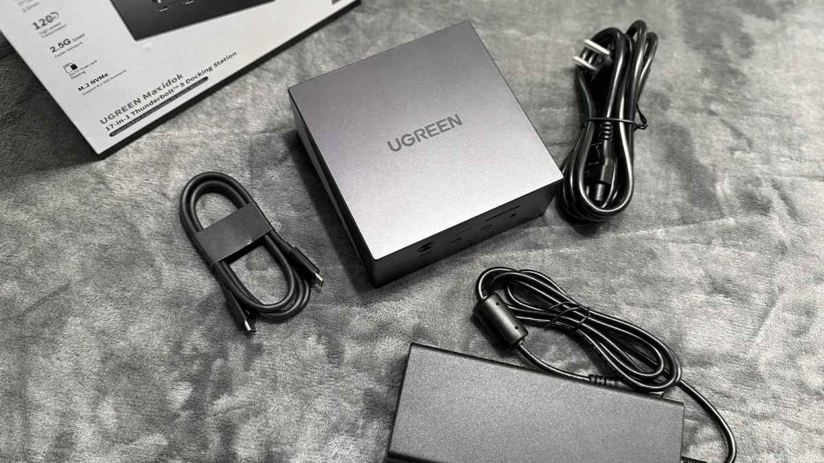The Ugreen Maxidok docking station displays its front panel with multiple connectivity ports.
