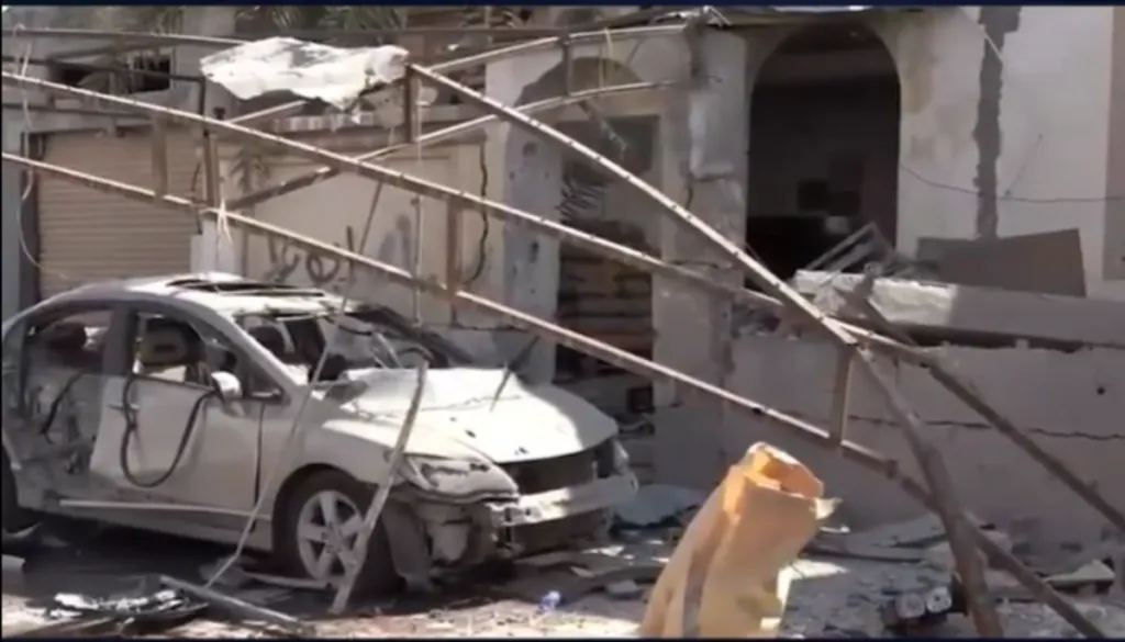 Scorched cars and damaged homes are visible following drone strikes on Bahrain.