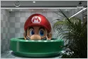 A stock chart displays Nintendo shares falling 8.2 percent following the 2026 Game Showcase.