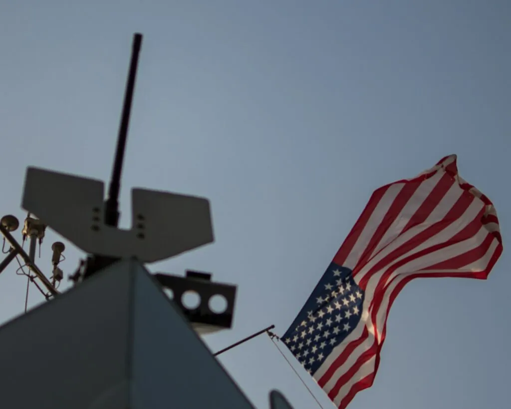 A US military aircraft disables a Palau-flagged oil tanker in the Gulf of Oman during a maritime blockade operation.