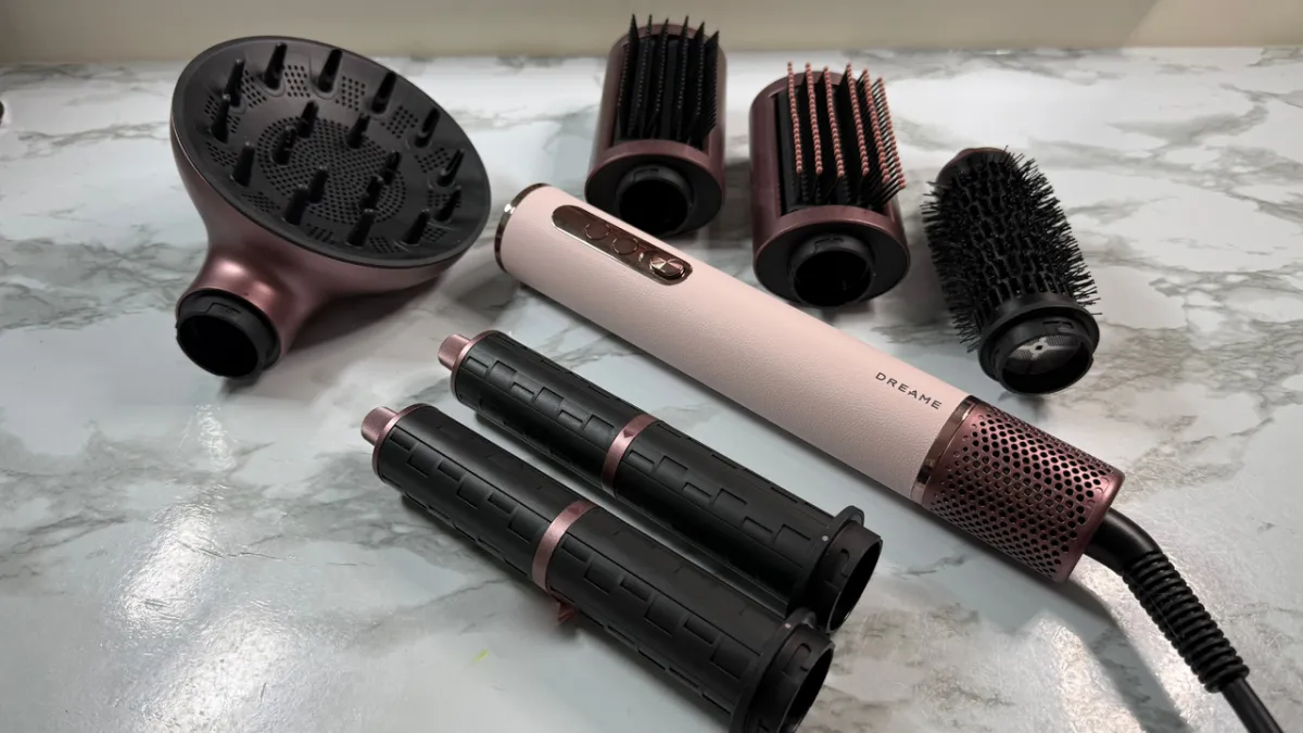 The Dreame AirStyle Era hair styling device is displayed alongside its eight interchangeable attachments.