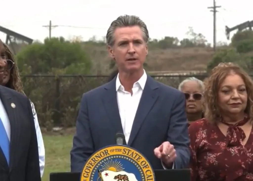California Governor Gavin Newsom addresses reporters at a press conference