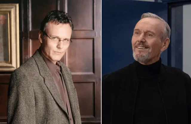 British actor Anthony Head poses in a dark suit against a neutral background during a professional photoshoot.