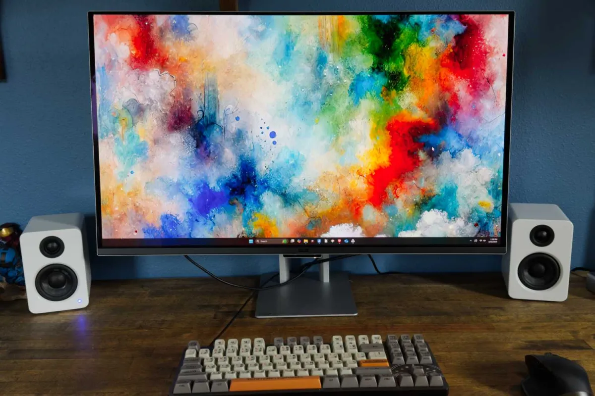 A modern 4K monitor displays productivity and gaming interface layouts.