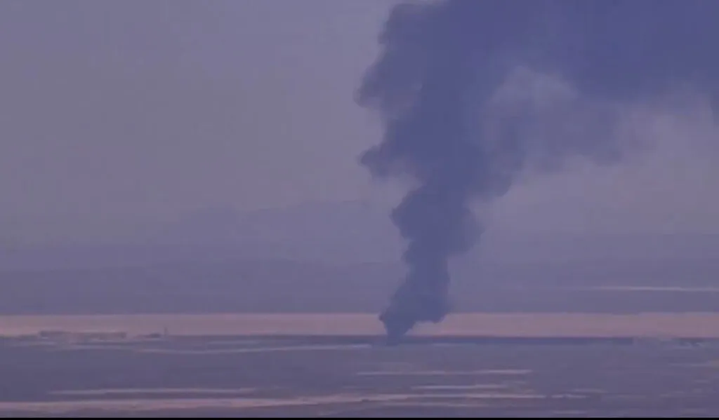 Emergency responders secure the area near a crashed B-52 Stratofortress at Edwards Air Force Base.