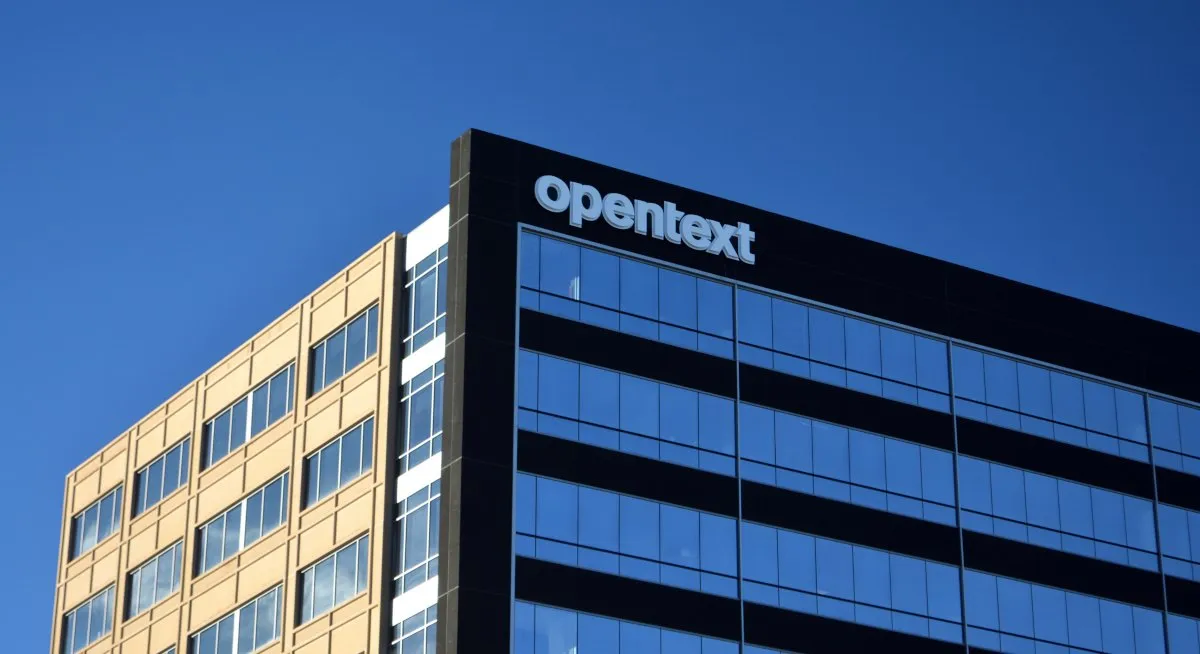 A modern office building in Cork represents OpenText's €105 million investment and 400 new job creation initiative.