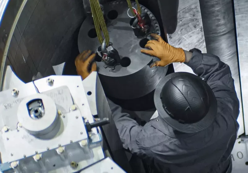 Technicians oversee a US microreactor during its first self-sustaining nuclear chain reaction test.
