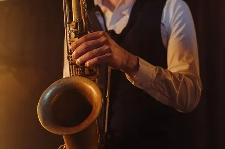 Jazz musicians record a cover of an AI-generated track in a studio to demonstrate audio verification technology.
