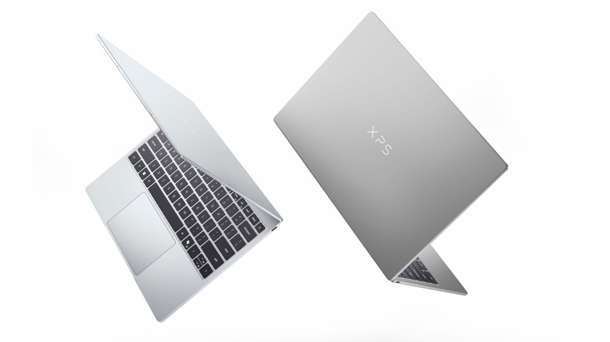 A closed Dell XPS 13 laptop displays its slim silver chassis and touchscreen.