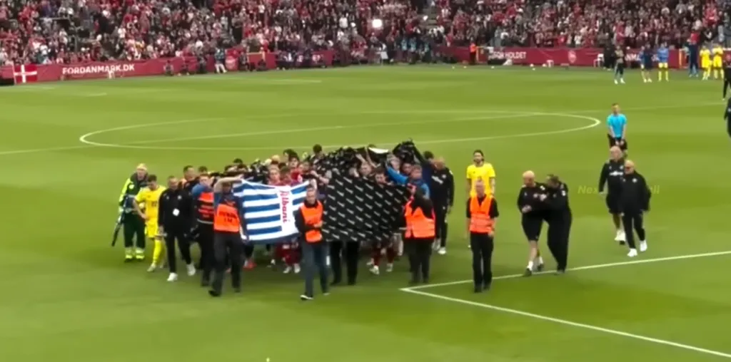 Christian Eriksen receiving medical attention on the pitch during a Denmark friendly match.