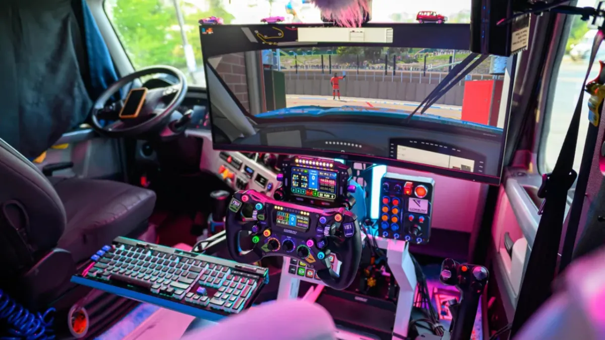 A compact racing rig with precision pedals and an ergonomic bucket seat occupies the passenger area of a semi-truck cabin.