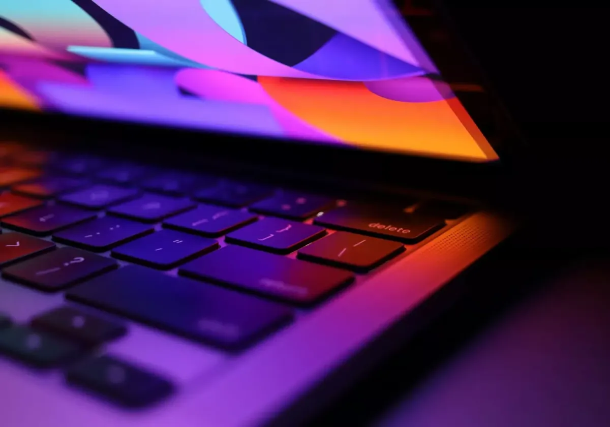 A lineup of modern laptops representing the top Mac, Windows, and Nvidia models of 2026