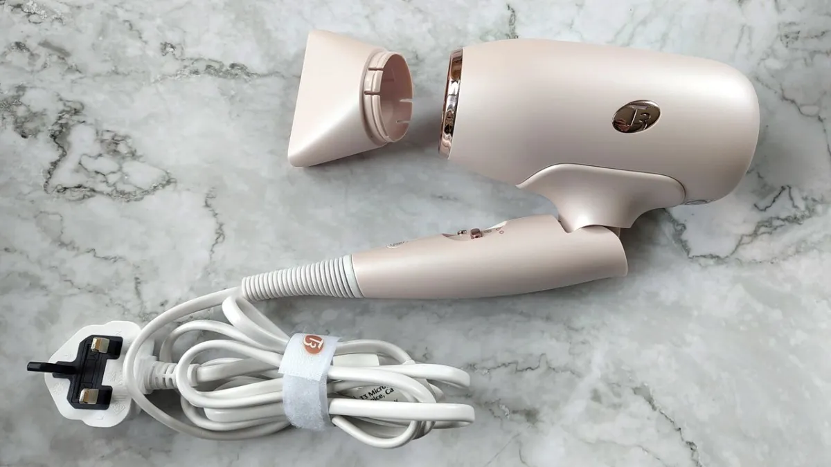This compact travel hair dryer features adjustable heat settings and universal voltage compatibility.
