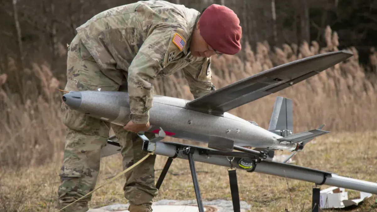 Technicians modify commercial drones at a decentralized field workshop to counter advancing electronic warfare systems.